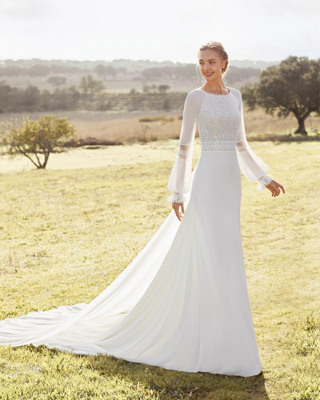 Vestidos de novia con escote redondo y manga poeta para la boda