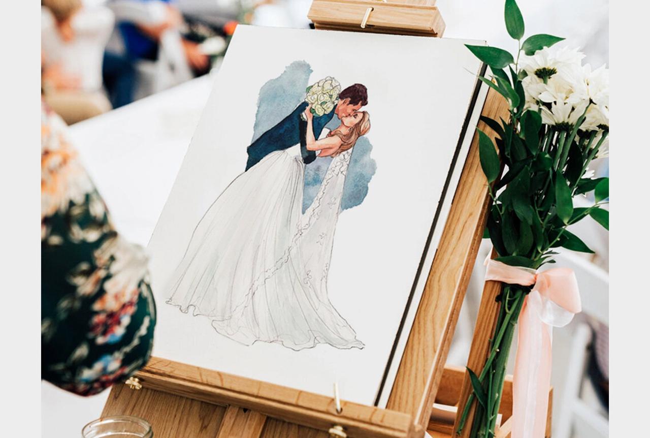 Dibujo acuarela boda: caballete con la ilustración de los recién casados