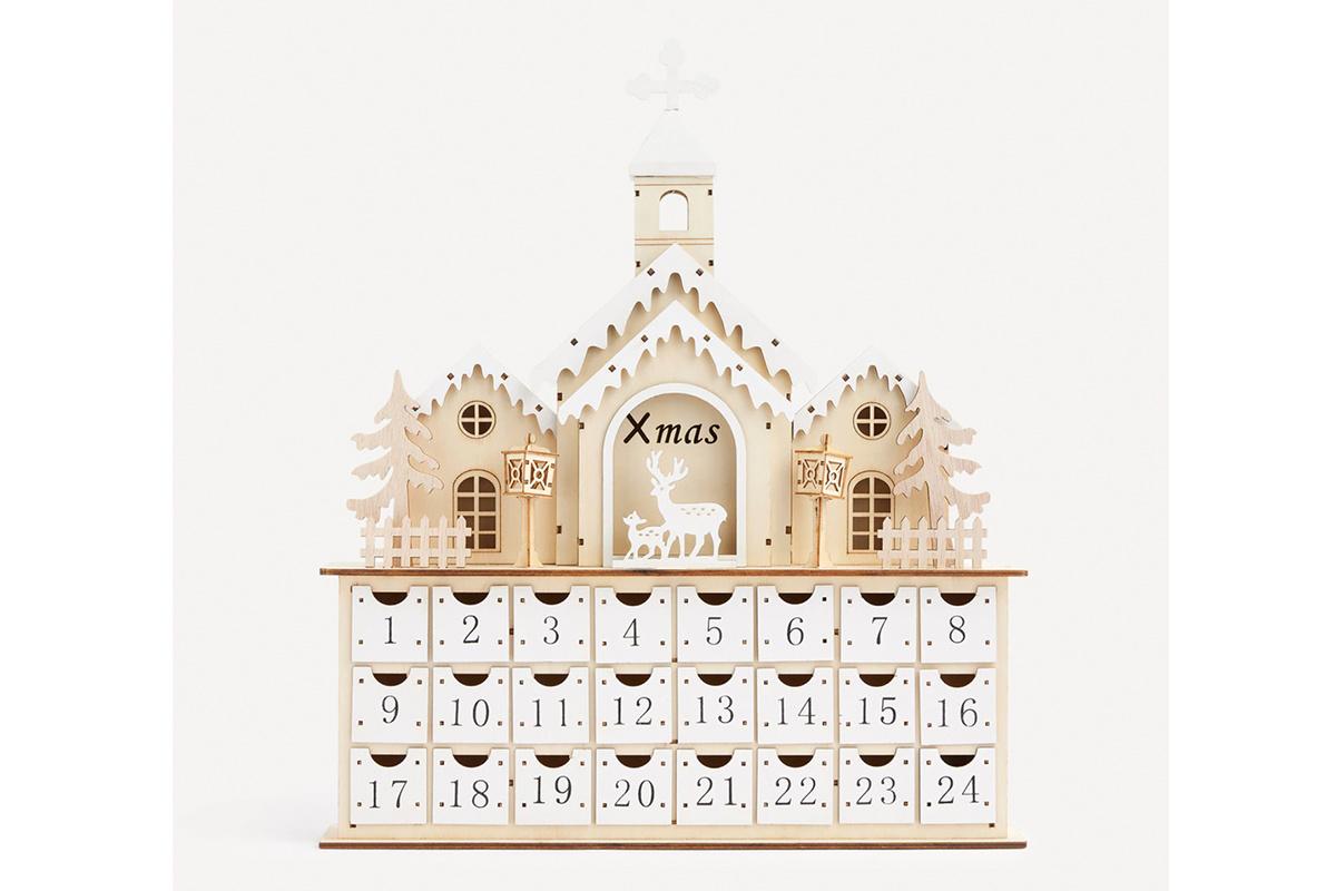 Calendario de Adviento con varias casas de madera en lo alto