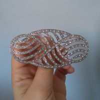broche para recoger la cola
