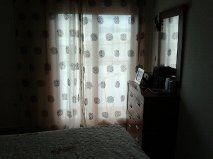 nuestro dormitorio con las cortinas