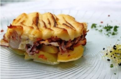 Pulpo gratinado sobre lecho de patata