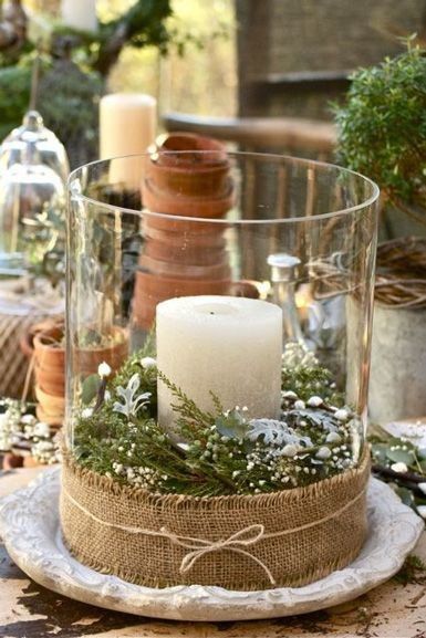 Vela, tela, cinta, tarro de cristal, y florecillas