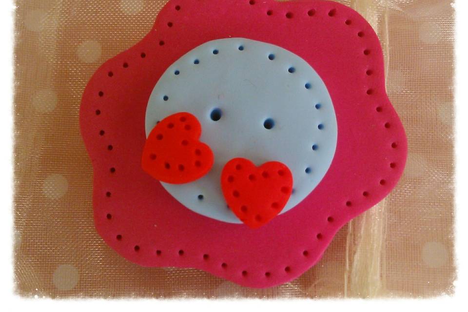 Broche dos corazones