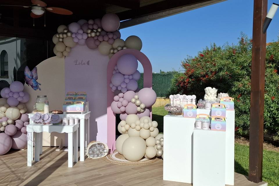 Photocall y mesa de dulces