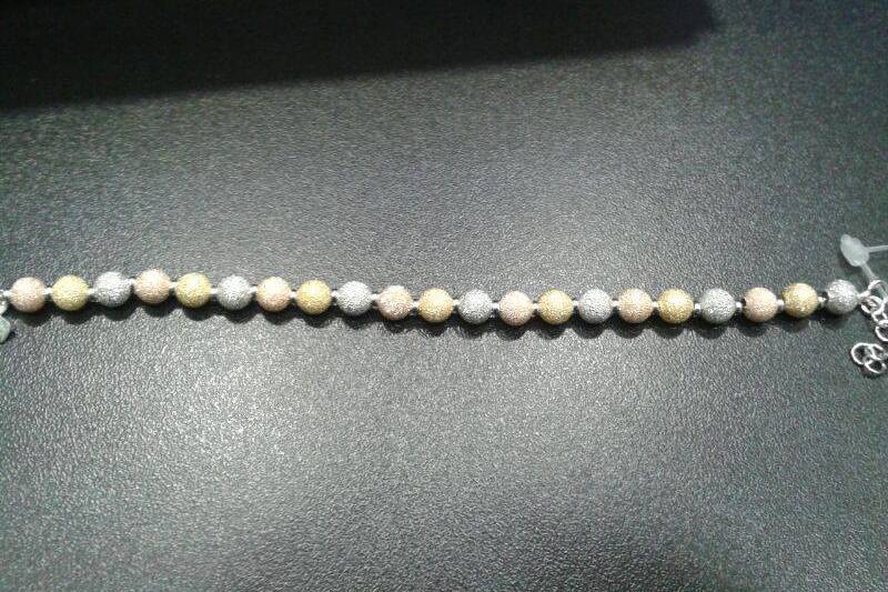 Pulsera de plata de tres oros