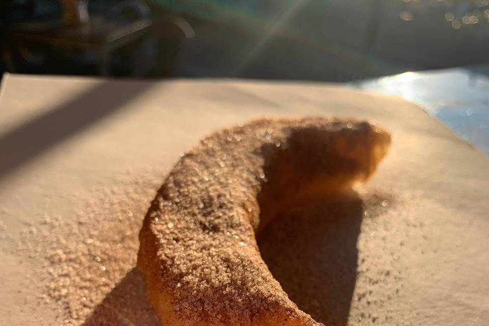 Churro con azúcar y canela