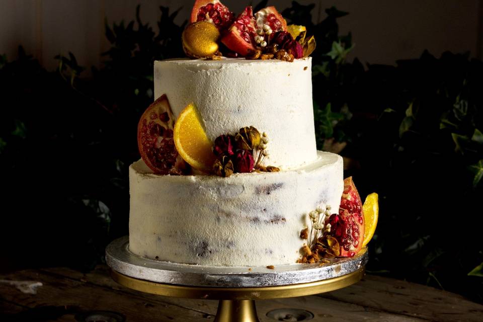 Tarta con granadas y naranjas