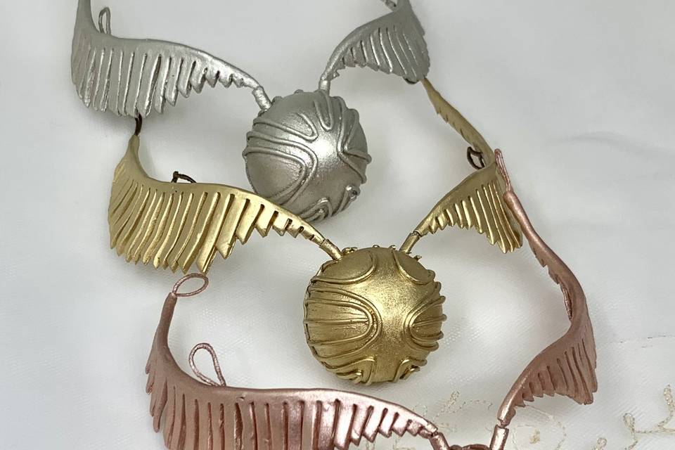 Snitch plata, oro, bronce