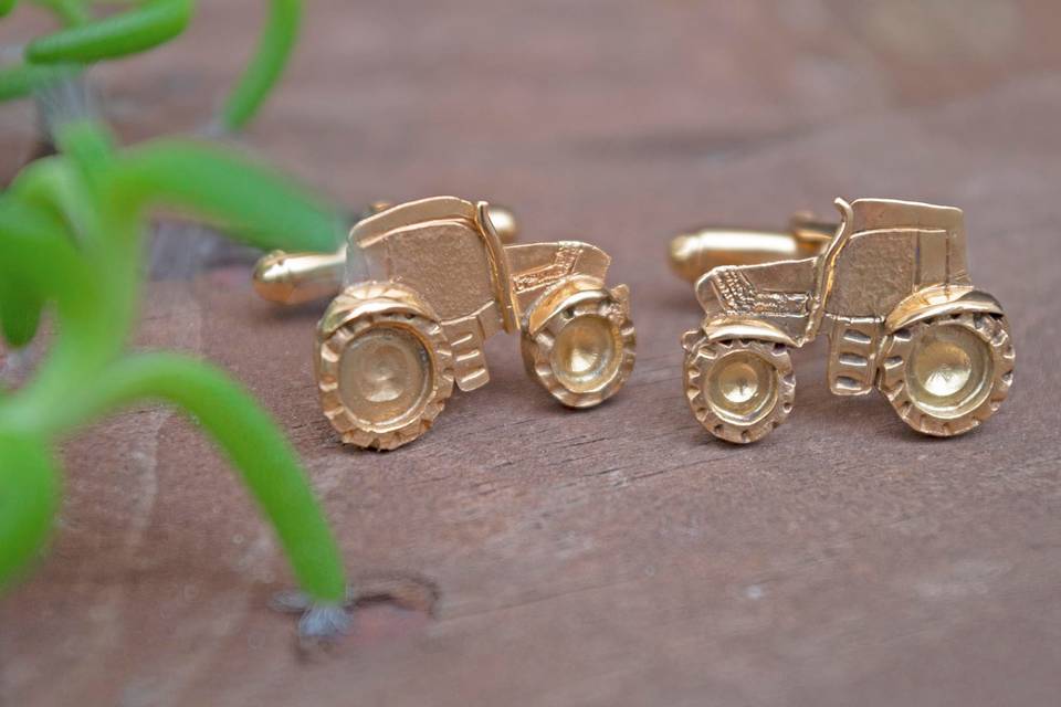 Gemelos de tractor con baño en oro