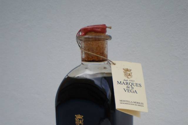 Botella con díptico